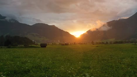 rainy sunset of austrian alps field