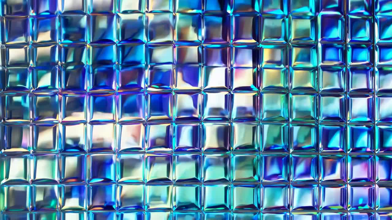 Close-up of a textured glass surface with vibrant blue and purple hues, creating a mosaic effect
