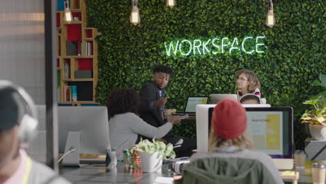 multi-ethnic-business-people-brainstorming-working-together-creative-marketing-team-sharing-ideas-discussing-strategy-enjoying-teamwork-in-trendy-startup-office-workspace