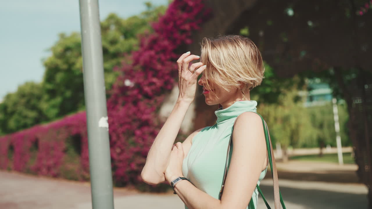 Woman posing outdoors in urban environment