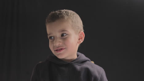 young baby boy smiling and showing different facial reactions to the camera while doing a film casting and camera test shot on 4k