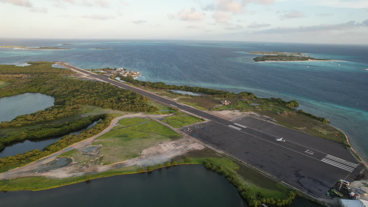 Gran roque runway, sunset takeoff, ocean islands, and serene nature , aerial view