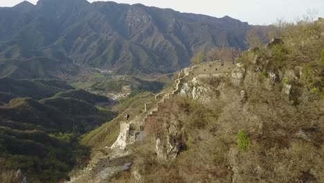 sweeping aerial orbit: dramatic wild section of great wall of china