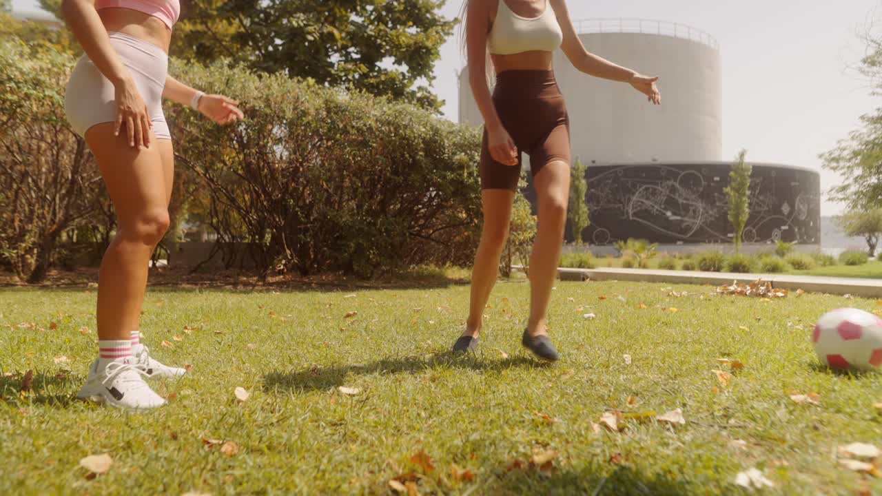 Women Playing Soccer in the Park