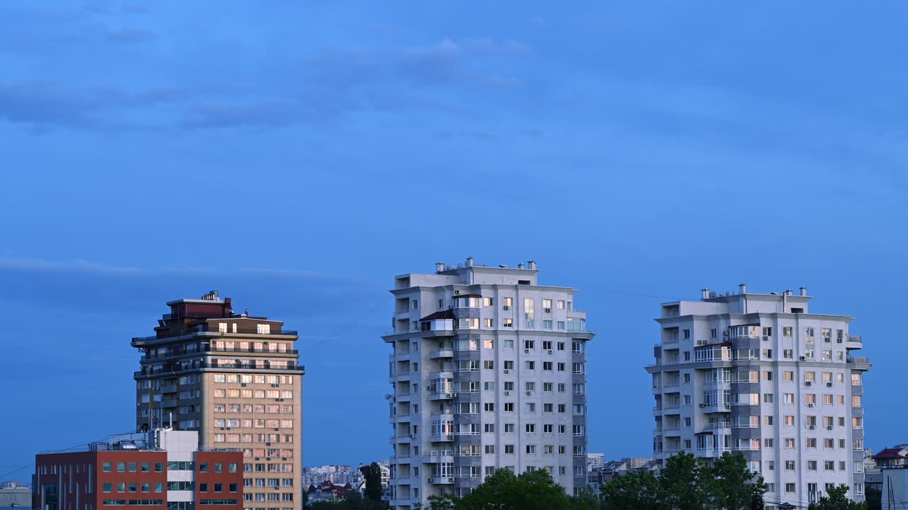 Time lapse of modern residential buildings under soft evening light and cloudy sky