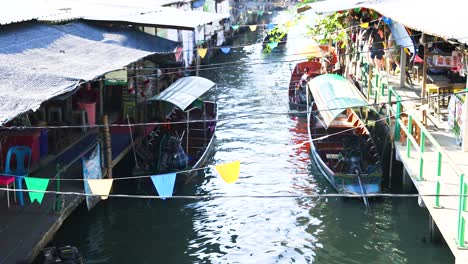 boats move through vibrant floating market in bangkok