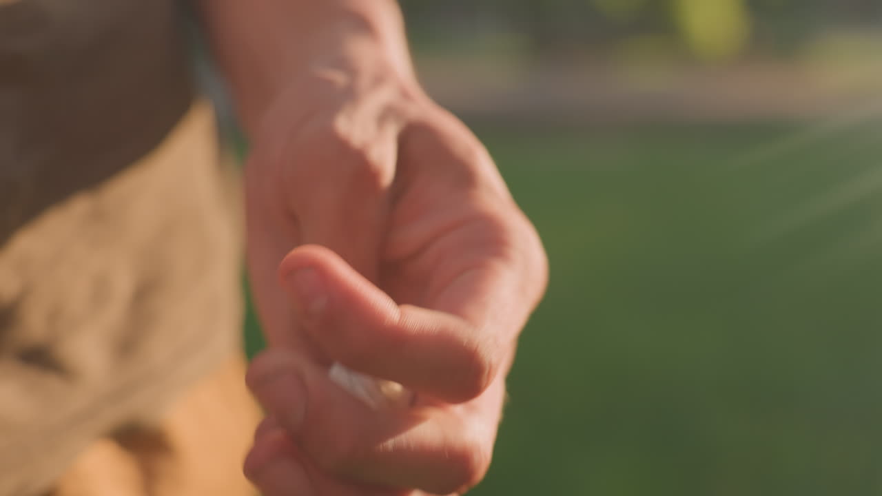 Closeup Of Man Counting Pebbles, Focused View Of Man Handling Small Stones Carefully, Intimate Portrayal Of Individual Meticulously Counting Tiny Stones With Intense Focus And Precision