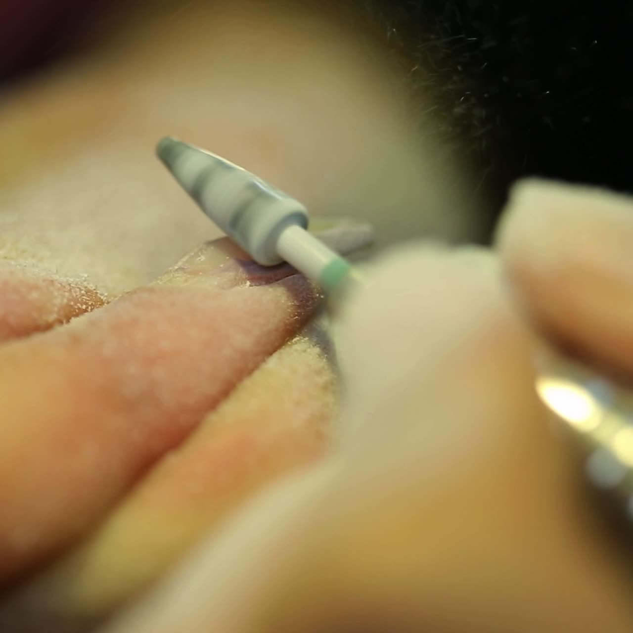 Woman polishing nails