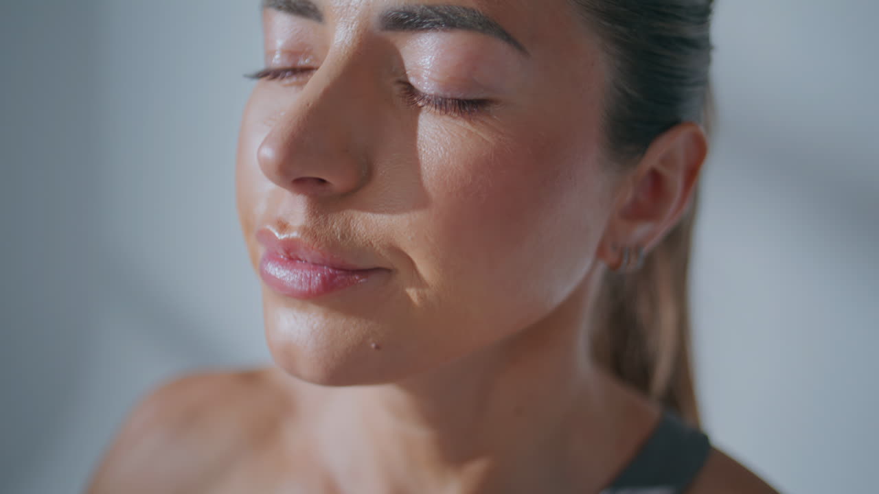 Portrait woman drinking water sport bottle at fitness workout. Thirsty girl