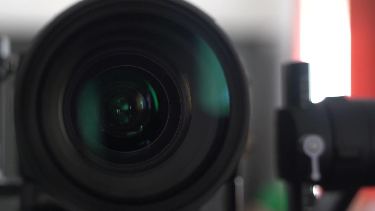 Slow motion Panning shot of a camera lens with reflections
