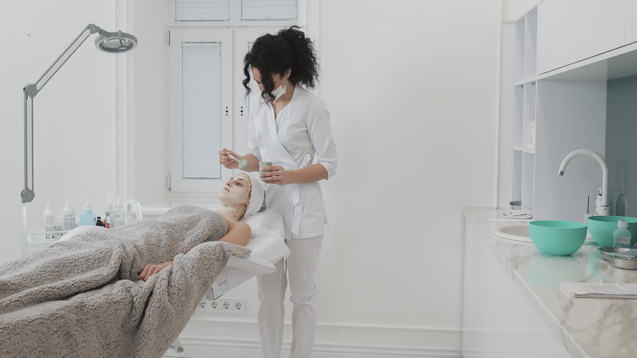 A woman getting a facial at a beauty salon