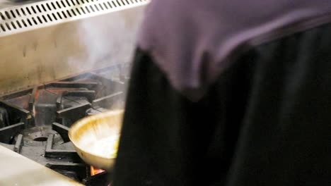 Sauteing-vegetables-on-gas-stove-with-flame