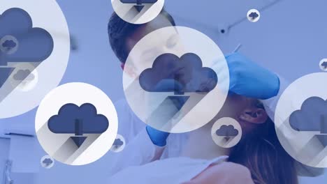 Animation-of-network-of-cloud-icons-over-caucasian-male-dentist-and-female-patient