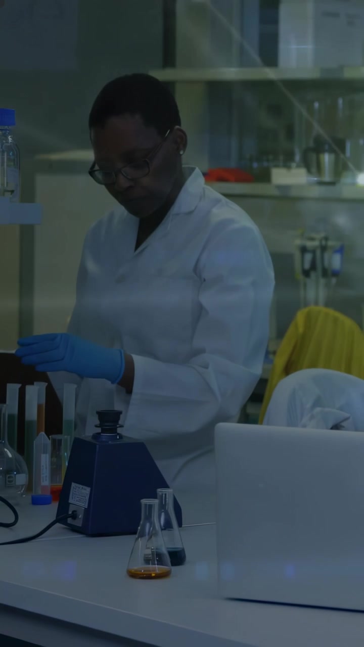 Vertical video: Glowing overlay shifting, lab tech pipetting and vortexing samples for testing