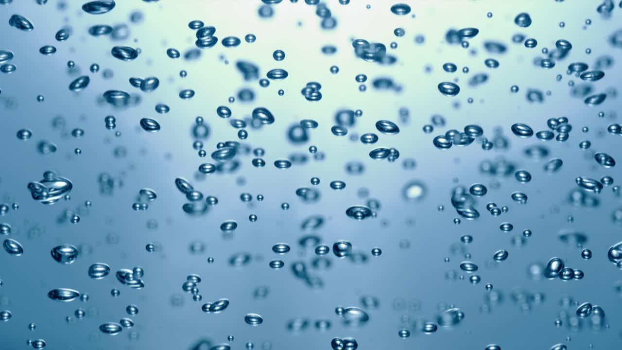 Molte bolle d'acqua in primo piano in acqua blu, onda d'acqua astratta con bolle al rallentatore