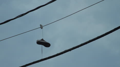 Shoes hanging on Power Lines