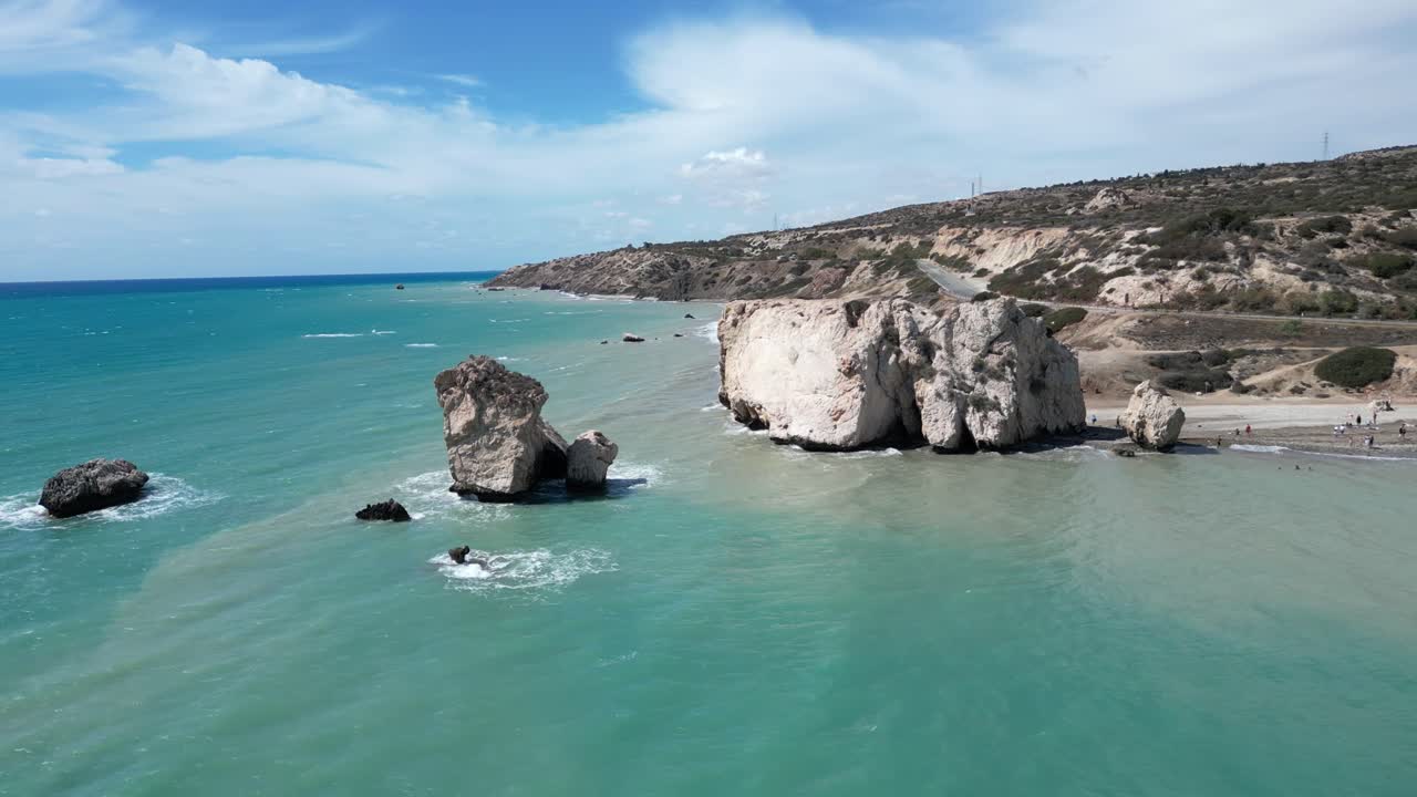 Petra tou Romiou Beach in Cyprus with turquoise waters, iconic rock formations, and coastal cliffs