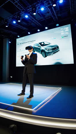 man interacting with virtual car model on large screen using vr technology at a presentation