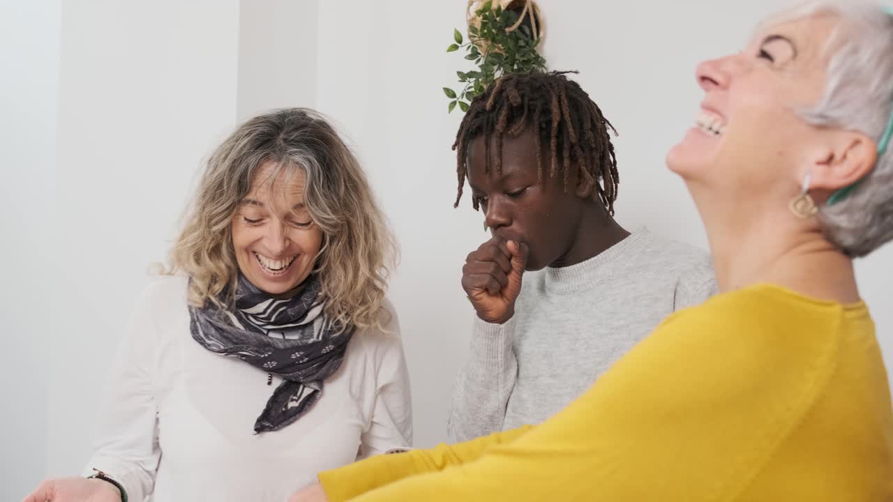 Diverse group of people sharing joyful moments indoors