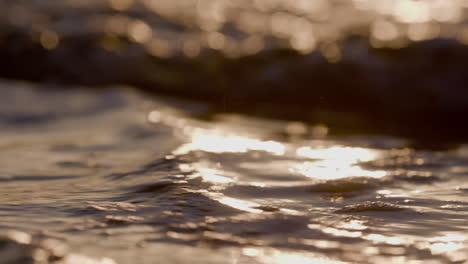 Sea-waves-rushing-at-the-beach-during-sunset