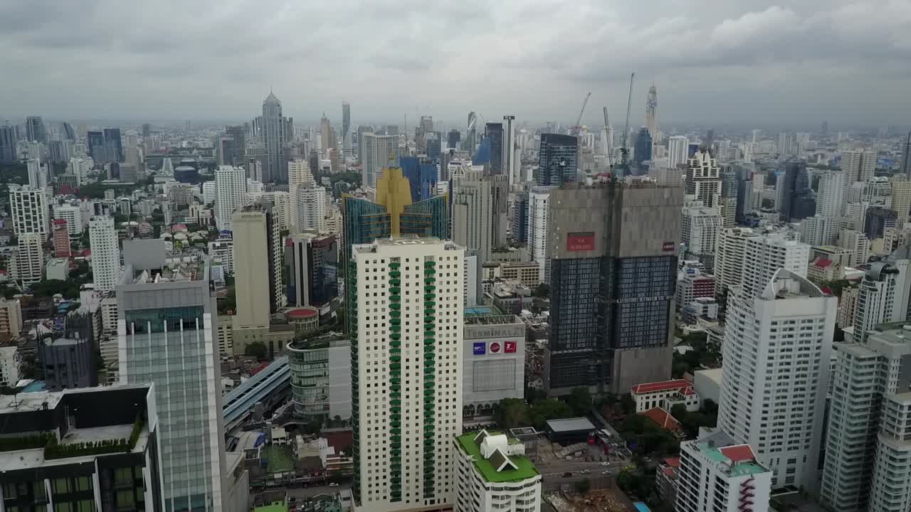 Modern Buildings in Bangkok, Thailand With Cloudy Sky Above - Aerial Shot