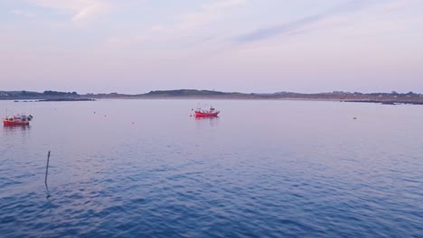 fishing boats at guernsey, channel islands, uk. aerial drone view