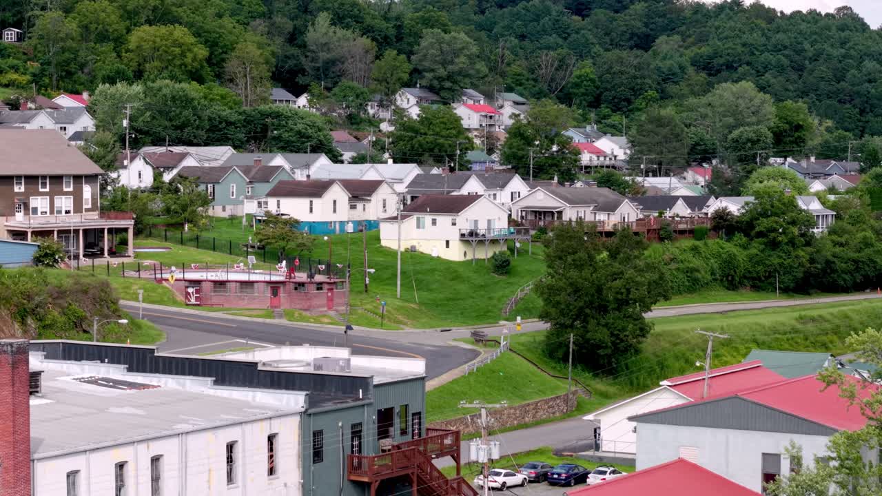 aerial push in to mill houses at company town Fries Virginia