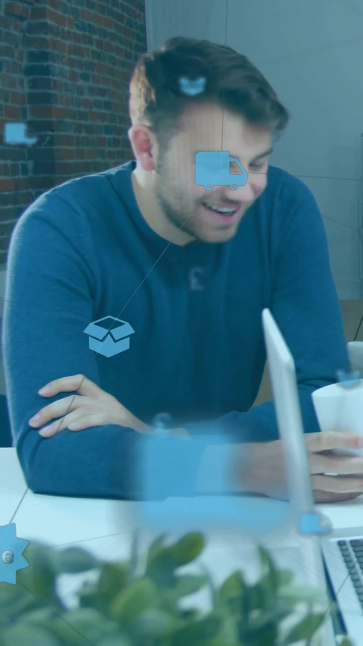 Vertical video: Man holding mug turning offframe, talking sales while icons passing over table