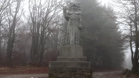 Explore the mystical charm of the "Old Statue of Radegast in the Forest in Czech Republic" footage, showcasing an ancient Slavic god amidst a lush, secluded woodland.