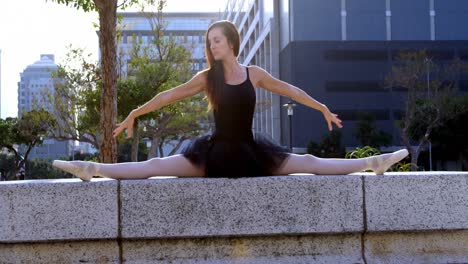 female ballet dancer stretching before dancing 4k