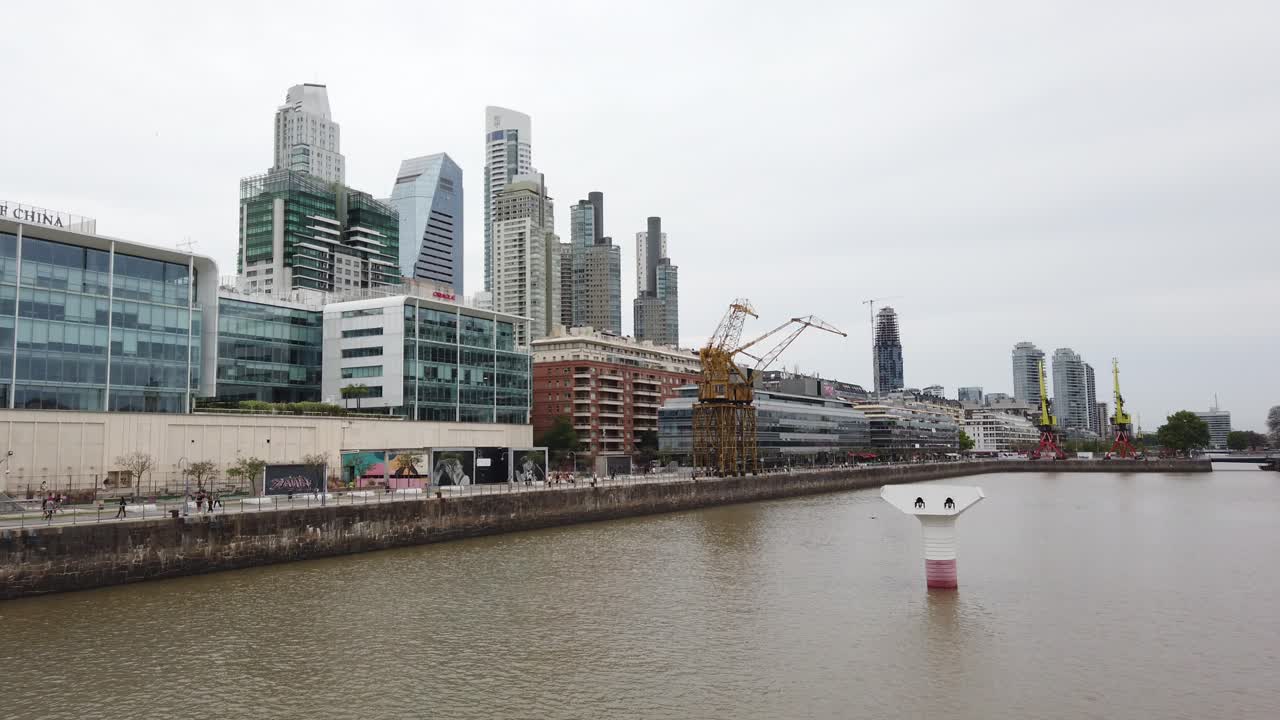 Panning view of Puerto Madero Skyscrapers, River and Bank of China buildings Dockside Business Center of Buenos Aires Argentina