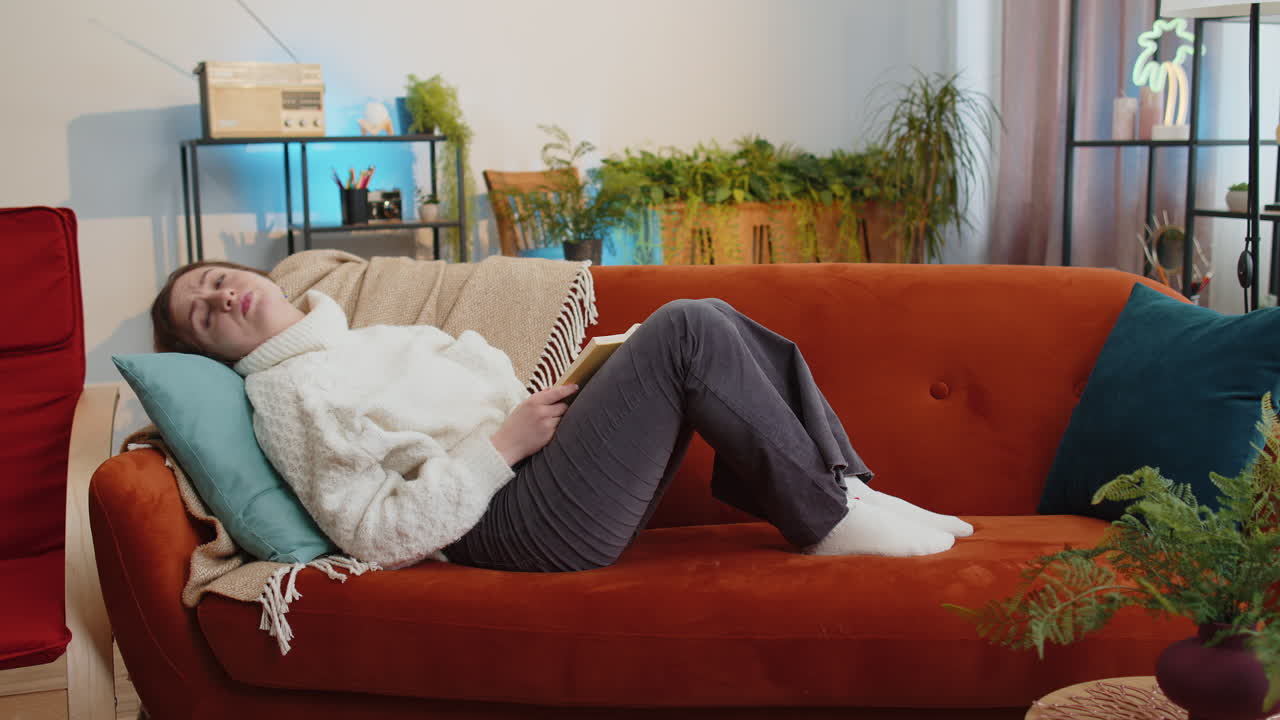 Repair work at neighbours concept irritated woman at home cover ears with pillows annoyed by noise