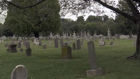 Catholic-Cemetery-with-tombstones,-trees-and-foliage