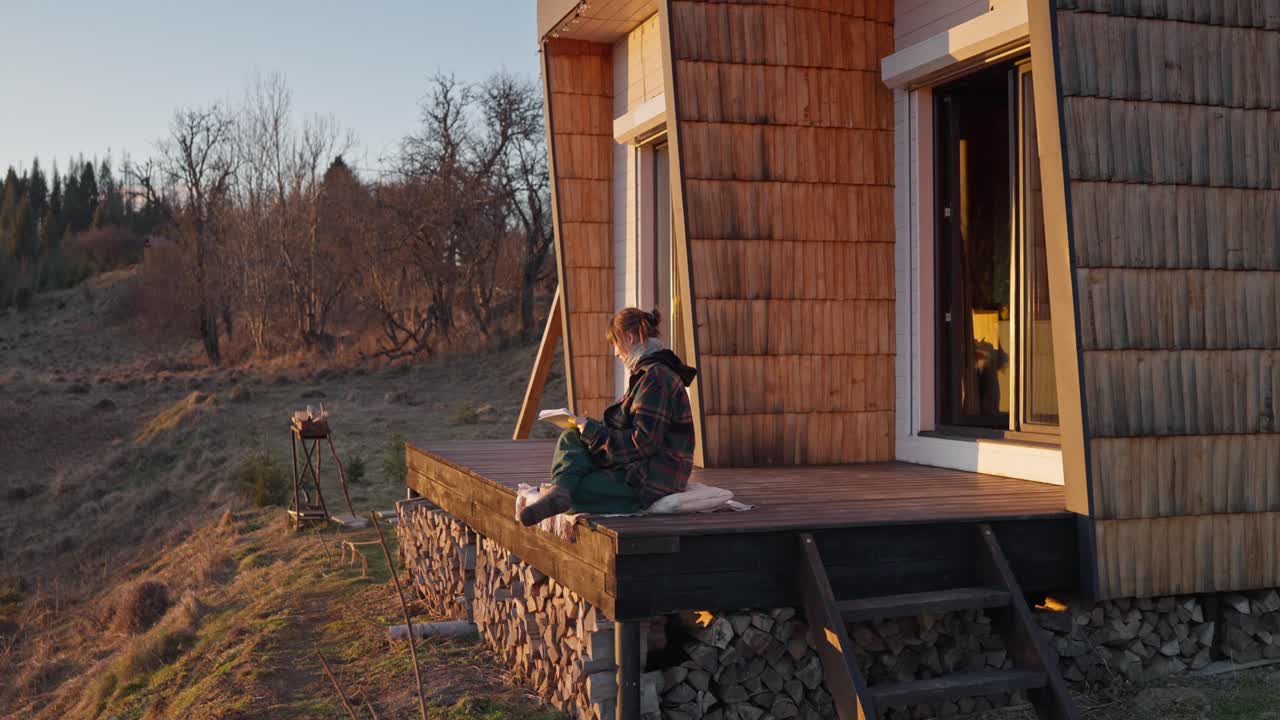 Woman Reading on Cabin Deck
