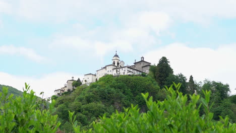 a view from the distance of the sacred mountain of varallo, a christian devotional complex, a unesco world heritage si in italy