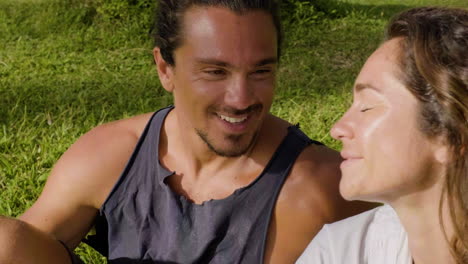 Young-couple-sitting-on-the-grass