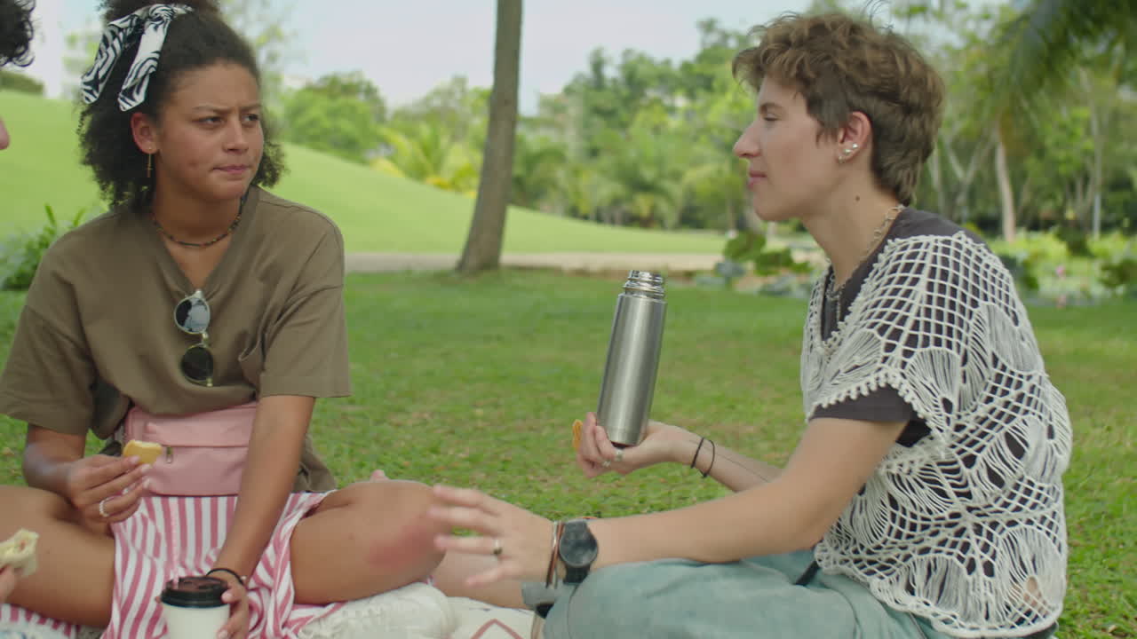 Gen Z Friends Chatting on Summer Picnic in Park