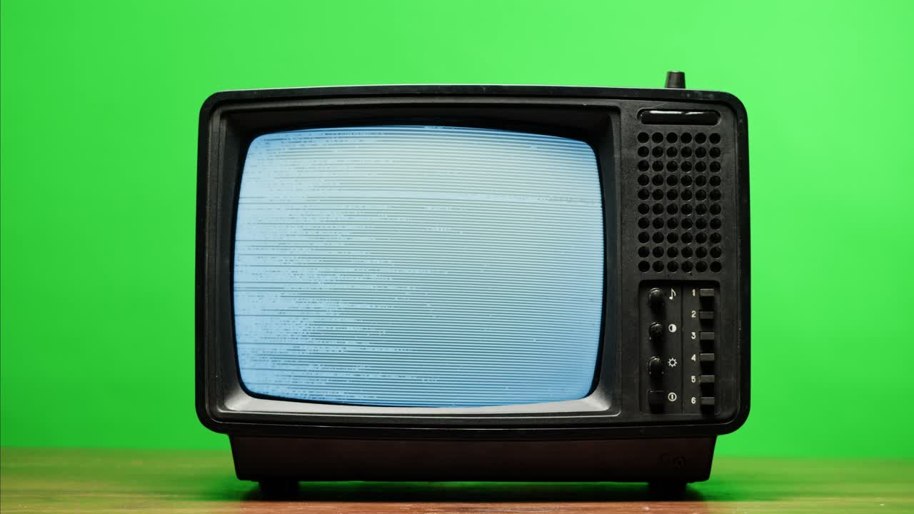 Retro Style TV Set with Green Screen chroma key background, vintage 60s analog television with grain and noise.