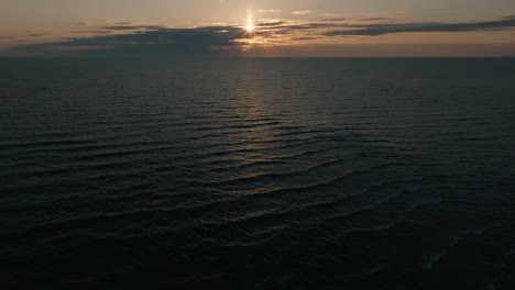 sunset over the calm waters of owen sound, ontario, with soft golden light