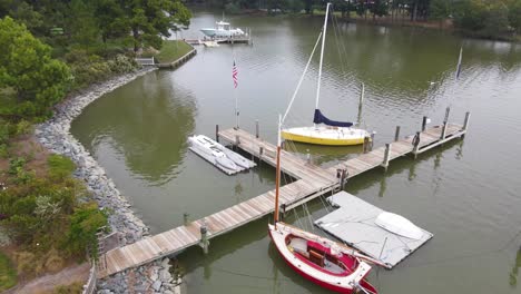 A-sweeping-drone-shot-going-around-a-couple-of-docked-sailboats