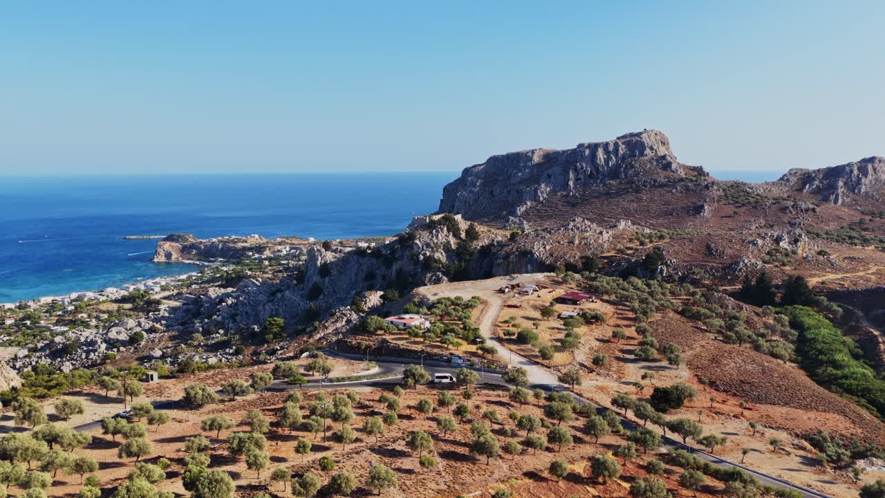 Coastal Landscape with Rock Formation and Village