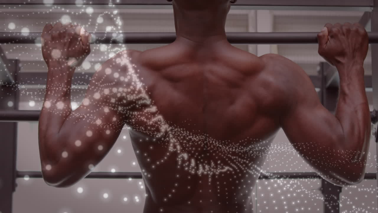 animación de manchas brillantes sobre un hombre fuerte haciendo ejercicio en el gimnasio