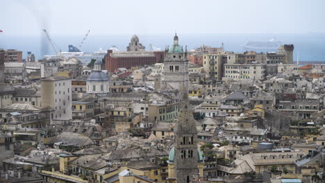 beautiful cityscape of genoa city with towers and rooftops, tilting up view