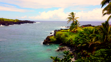 lovely keawaiki bay wide static of pacific ocean waves and black lava rocks on road to hana, maui, hawaii, 4k prorezhq