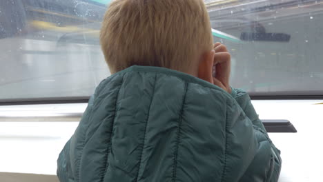 child traveling in subway train