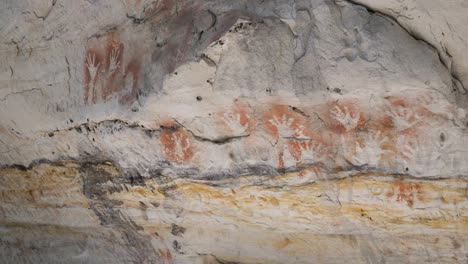 aboriginal rock art paintings displaying stories of dreamtime on ancient cave walls from indigenous australian first nation people