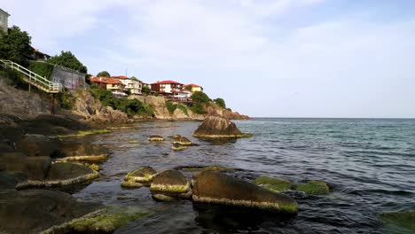 low flight over sea and rugged rocks at coastal town of sozopol