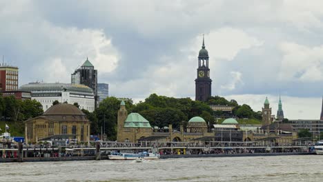 cinematic shot of hamburg city with skyscape at background and speedboats on sea in germany