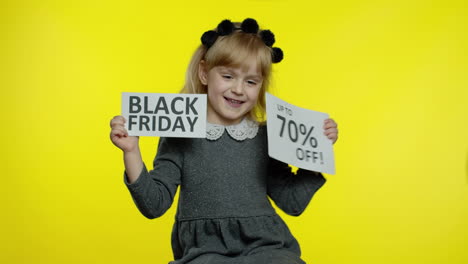 Child-girl-showing-Black-Friday-and-Up-To-70-Percent-Off-advertisement-banners.-Low-prices,-shopping