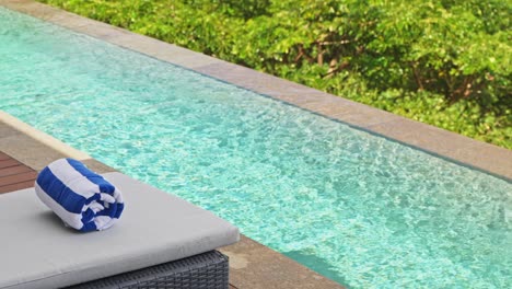 beach towel at luxury private villa in indonesia sitting on the edge of sun lounger